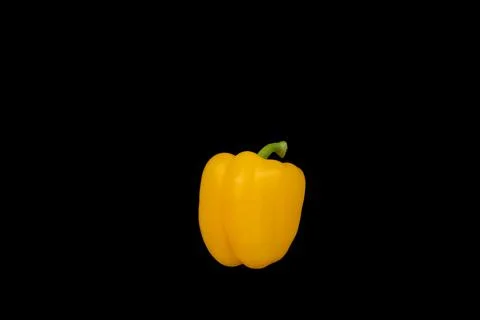 Yellow bell pepper on a black background. Isolated. Stock Photos