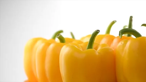 Yellow bell pepper close up, rotating on white background Stock-Footage 233578945