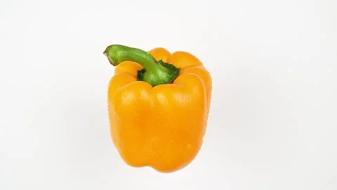 Yellow Bell Pepper Rotating On White Background With Water Drops Stock Footage 325563226