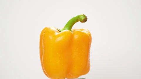 Yellow Bell Pepper Rotating On White Background With Water Drops Stock Footage 325563467
