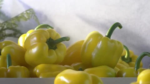 Yellow bell peppers composition in a table Stock Footage 132602918