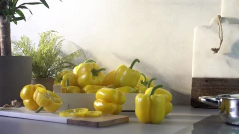 Yellow bell peppers composition in a table Stock Footage 132602984