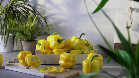 Yellow bell peppers composition in a table Stock Footage 132603008