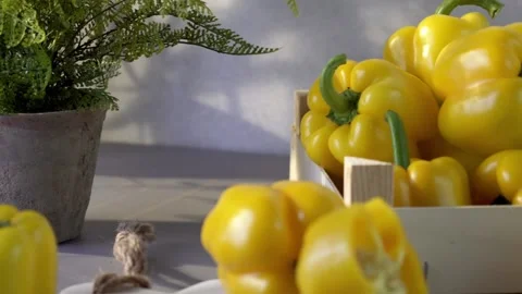 Yellow bell peppers composition in a table Stock Footage 132603088
