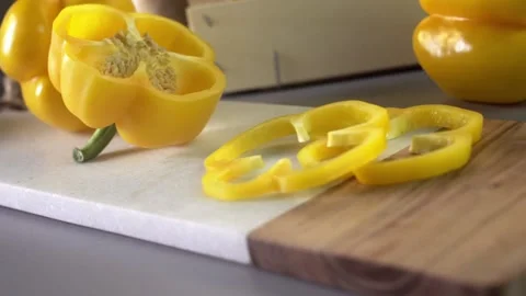 Yellow bell peppers composition in a table Stock Footage 132603229