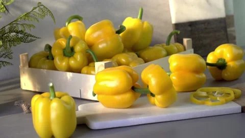 Yellow bell peppers composition in a table Stock Footage 132603247