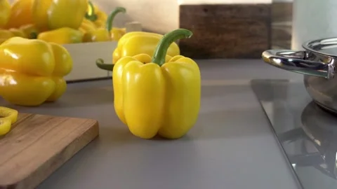 Yellow bell peppers composition in a table Stock Footage 132603266