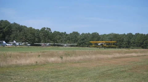 YELLOW BI PLANE TAKES OFF Stock Footage 29995542