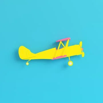 Yellow biplane on bright blue background in pastel colors. Minimalism concept Stock Illustration