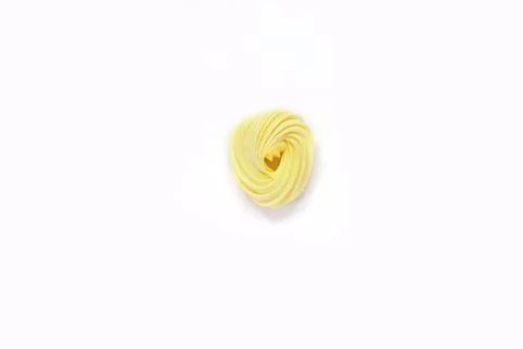 Yellow bize, multi-colored sweets, airy cakes on isolated white background fo Stock Photos