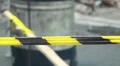 Yellow black striped tape outdoors, police investigation line HD Footage