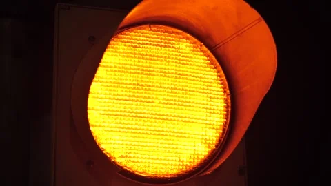 Yellow Blinking Traffic Light Close Up Stock Footage 302122408