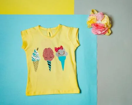 Yellow blouse with a pattern of ice cream Stock Photos