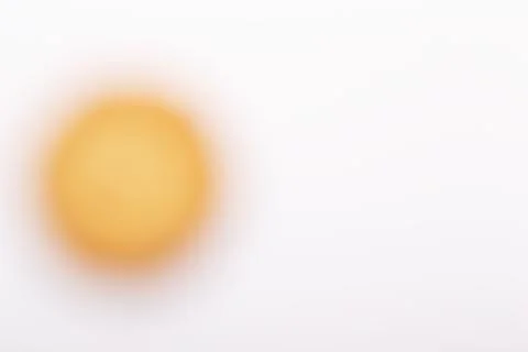 Yellow blurred circle on a white background 스톡 사진