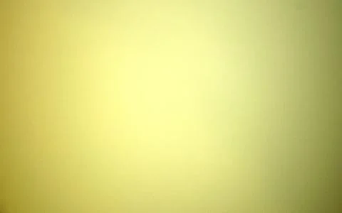 Yellow blurred solid color background. Texture, gradient, vignetting, close-u Stock Photos