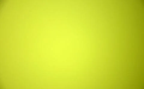 Yellow blurred solid color background. Texture, gradient, vignetting, close-u Stock Photos