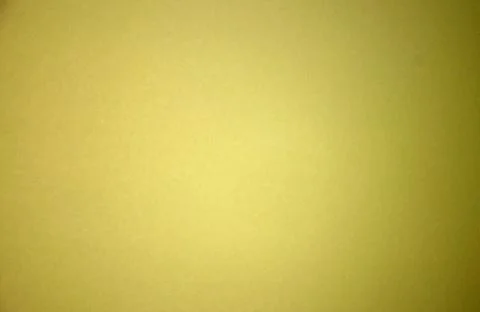 Yellow blurred solid color background. Texture, gradient, vignetting, close-u Stock Photos