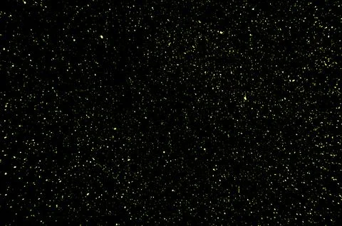 Yellow bokeh on a black background. Stock Photos