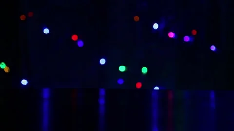 Yellow bokeh lights blinking actively over colorful night background Stock Footage 340367997