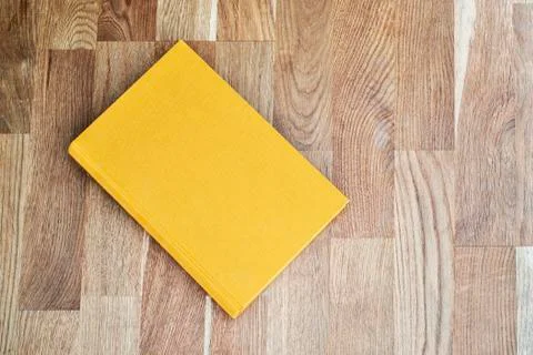 Yellow book on the table Stock Photos