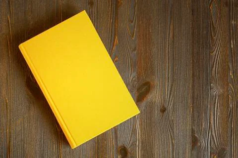 Yellow book on the table Stock Photos