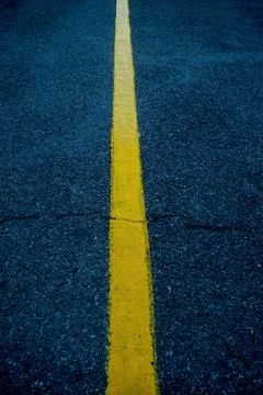 Yellow border in the middle of the road Stock Photos