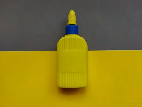 Yellow bottle against yellow gray background Stock Photos