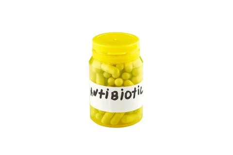Yellow bottle with antibiotics. Isolated on white background Stock Photos