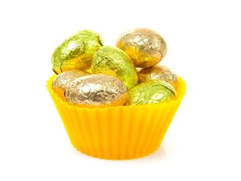Yellow bowl with easter eggs Stock Photos