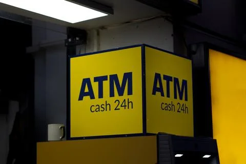 Yellow box cube with monogram ATM, cash 24 hour on payment machine Stock Photos