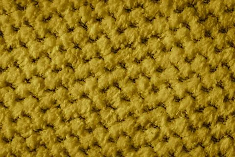 Yellow braided material with an interesting pattern Stock Photos