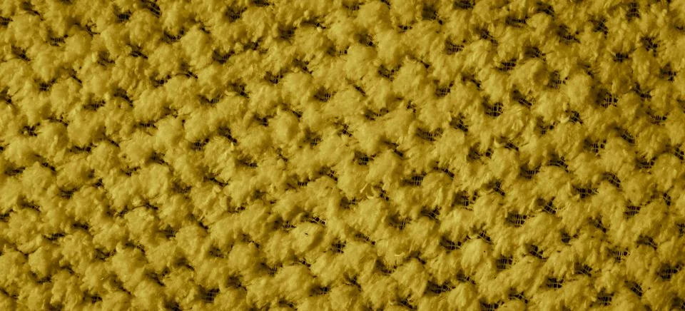 Yellow braided material with an interesting pattern Stockfoto's