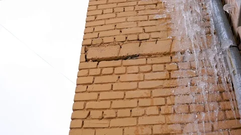 Yellow, brick, icy wall. Stock Footage 103862184