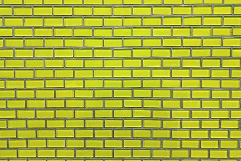 Yellow brick tile wall pattern in indoor architectural surface Foto stock