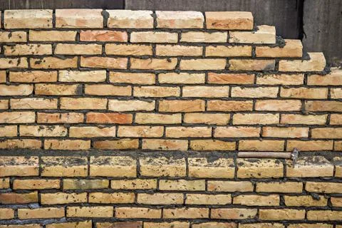 Yellow brick wall background Stock Photos