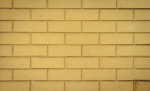 Yellow brick wall background Stock Photos