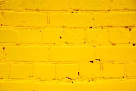 Yellow brick wall as a background Stock Photos