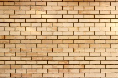 Yellow brick wall background Stock Photos