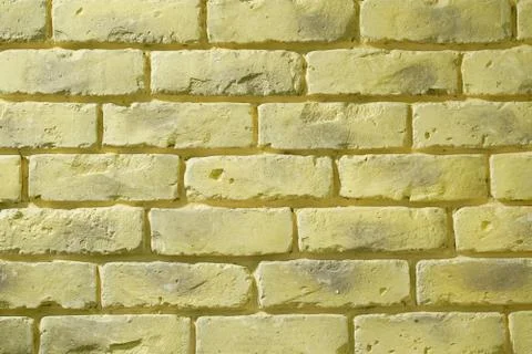Yellow brick wall background Stock Photos