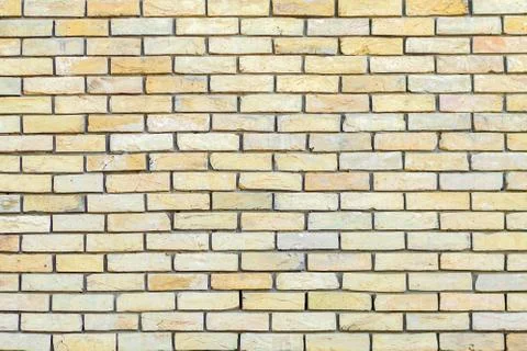 Yellow brick wall background Stock Photos