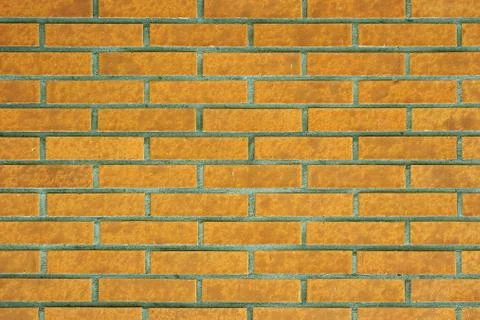 Yellow brick wall background Stock Photos