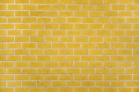 Yellow brick wall background Stock Photos