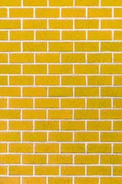 Yellow brick wall background Stock Photos