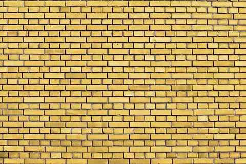 Yellow brick wall background Stock Photos