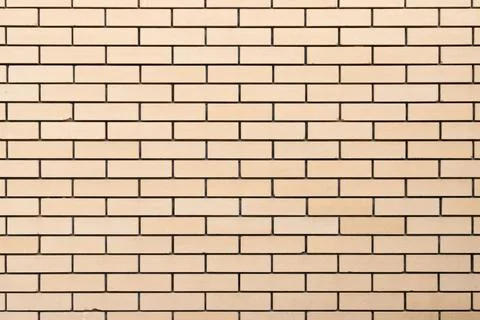 Yellow brick wall, front view, background texture Stock Photos