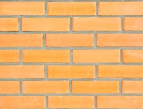 Yellow brick wall texture background Stock Photos
