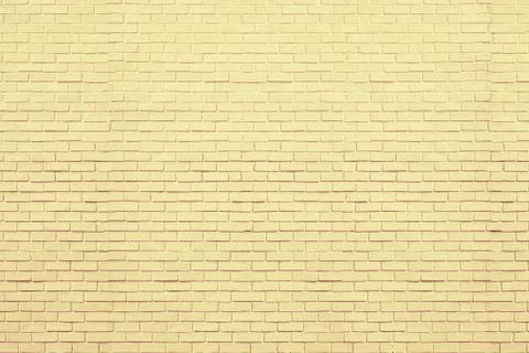 Yellow bricks pattern on wall for abstract background. Stock Photos