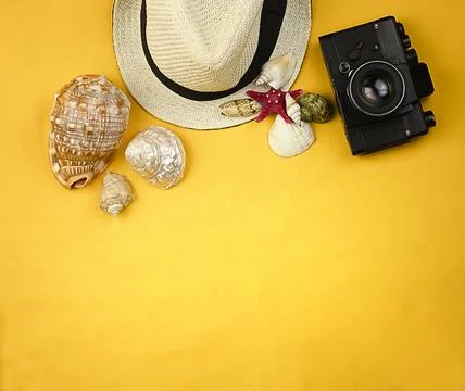Yellow bright background with seashells, red starfish Stock Photos