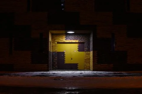 Yellow brown double-leaf gate on a winter evening Stock Photos