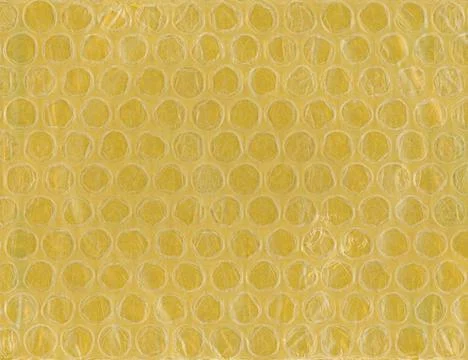 Yellow bubble wrap plastic and paper texture background 스톡 사진